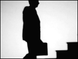 Video Clip - Human figures depicted in black in front of a white background; man with brief case going up the stairs