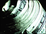Video Clip - Roll of hundred dollar bills spinning