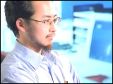 Video Clip - Japanese man staring blankly at a computer monitor