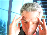 Video Clip - Stressful older man massages his head with both hands