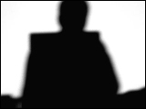 Video Clip - Human figures depicted in black in front of a white background; man staring at his computer screen