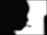 Video Clip - Human figures depicted in black in front of a white background; zoomed in on a woman with headsets on