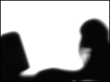 Video Clip - Human figures depicted in black in front of a white background; woman typing away on her computer