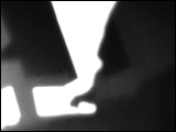 Video Clip - Human figures depicted in black in front of a white background; set of hands typing away
