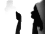 Video Clip - Human figures depicted in black in front of a white background; people on the phone walking away.