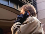 Video Clip - A man in winter attire using a cell phone