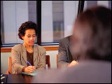 Video Clip - A group of people taking notes during a meeting