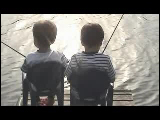Video Clip - Two little boys sitting beside each other and fishing