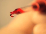 Video Clip - A dropper releasing drops of red liquid