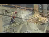 Video Clip - A highrise being built with crane, tools and other heavy machinery